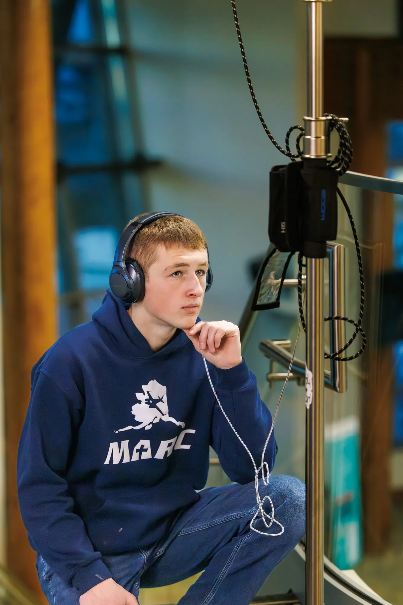 Sound engineer recording clean audio on location during hospital documentary