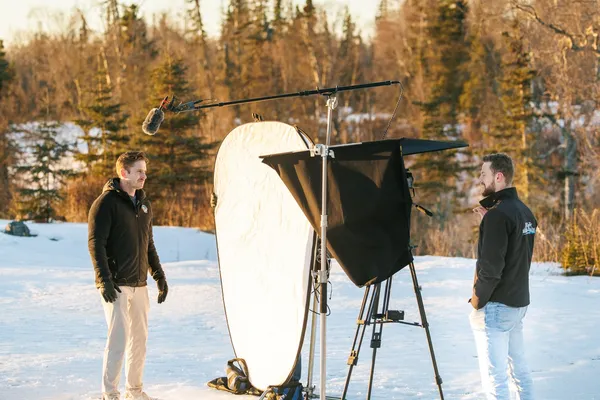 Martin Media 3-person production crew filming in snow at golden hour